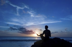 man-meditating-near-sea
