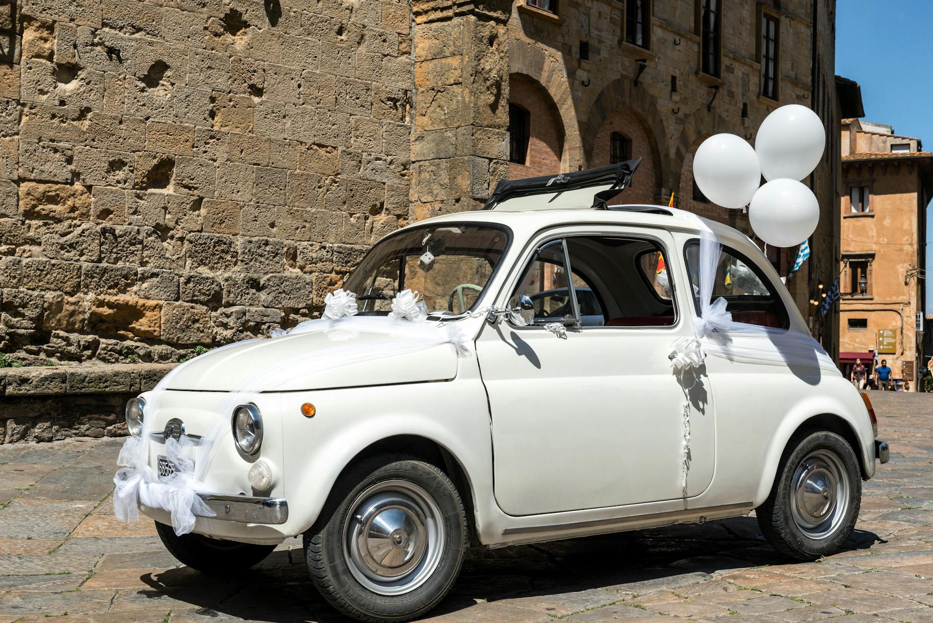 White Fiat 500 as Wedding Car on Street in Italy